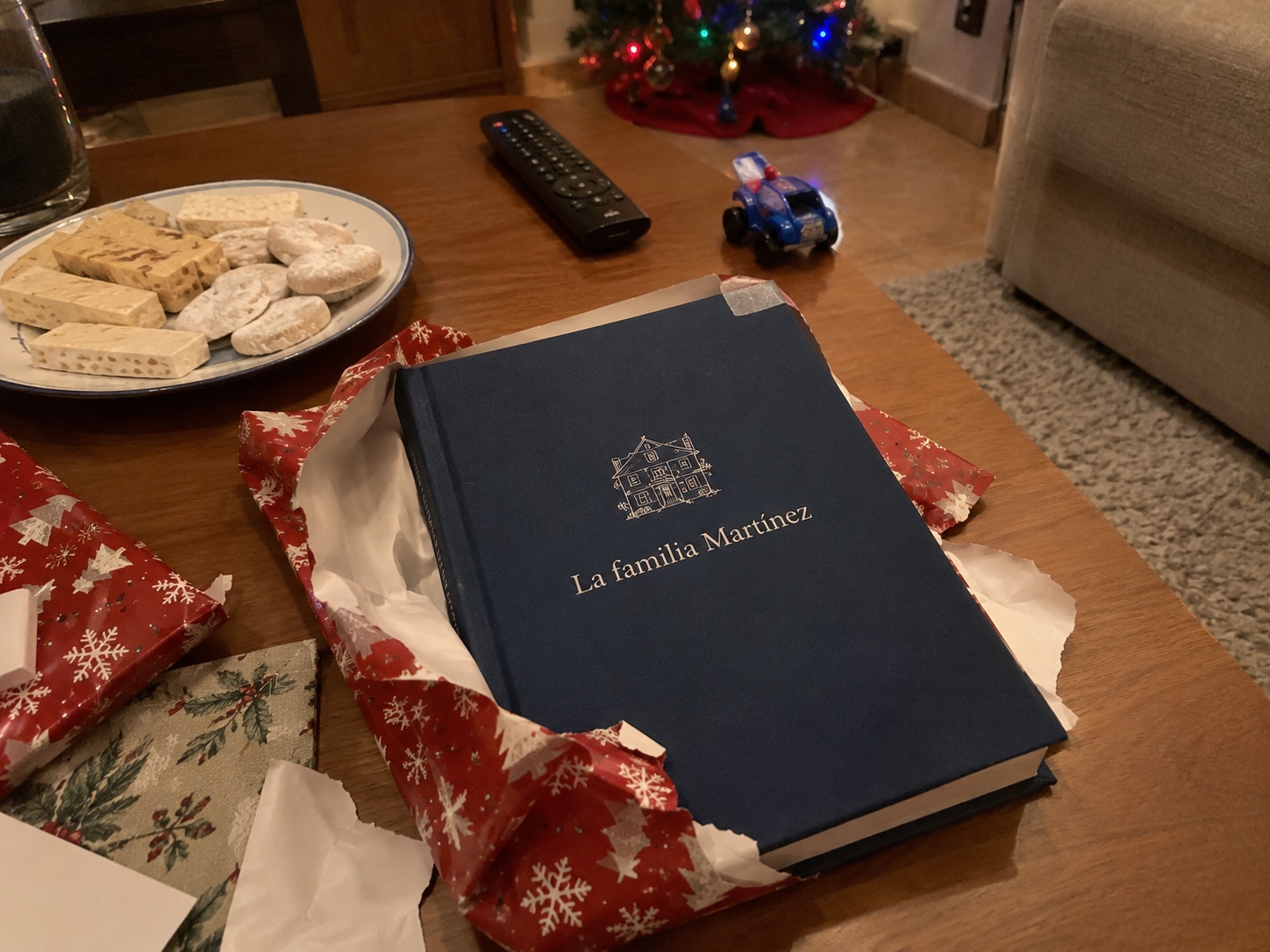 family celebrating a golden wedding anniversary with a gift